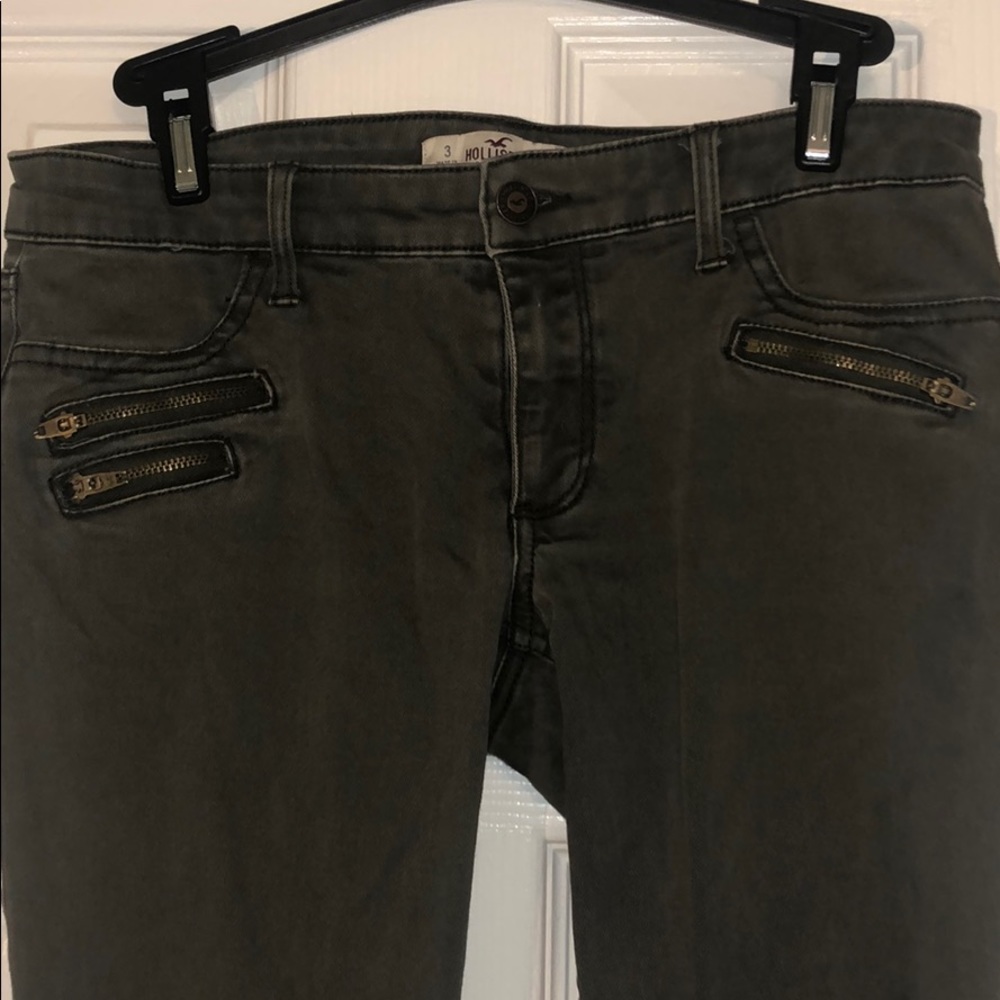 green jeggings with zippers in the front